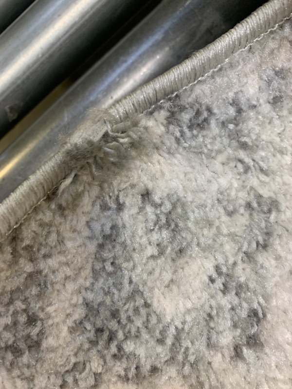 Photo 2 of 4'x6' Area Rug., Color Gray and White, No Box Packaging, Moderate Use, Creases and Wrinkles in Item, Hair Found on Item, Tape on Item, Dirty From Previous Use, Fraying on Edge as shown in Pictures