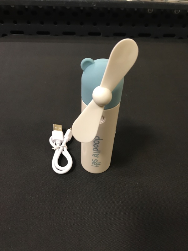 Photo 1 of KOODER Handheld Fan, Mini Fan,Portable Misting Fan, USB Rechargeable Fan. 1200mAh Battery Operated for 6 Hrs Continuous Work. (Blue)

