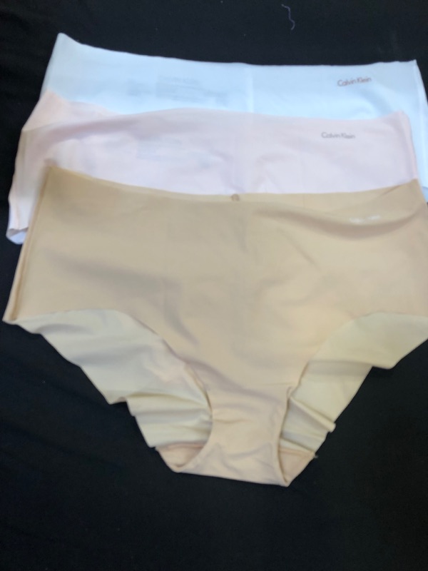 Photo 2 of Calvin Klein Women's 3 Pack Invisibles Hipster Panty, Pink/White/Light Caramel, -- Size Large --
