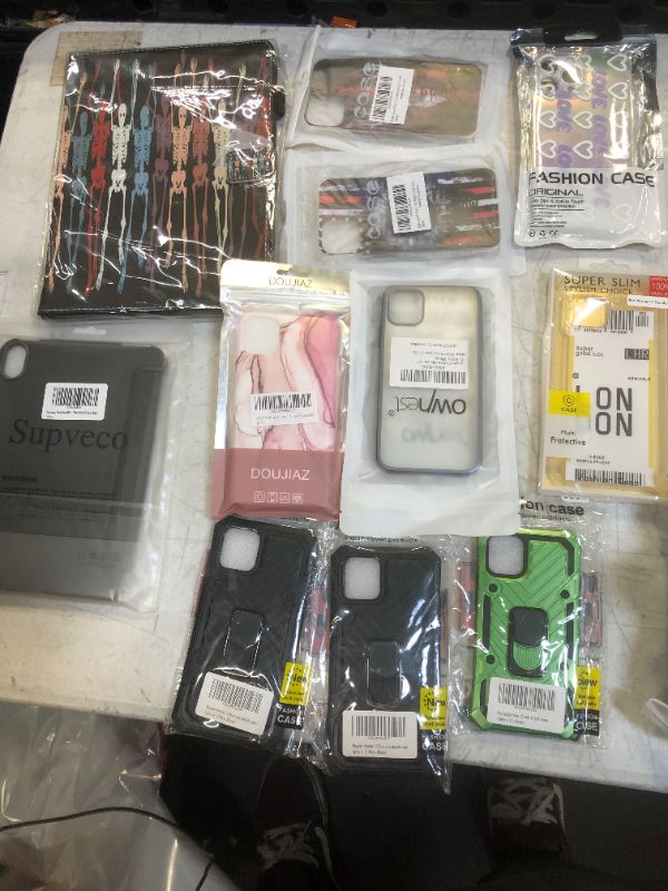 Photo 1 of  Bag Lot -- iPad Case for iPad Mini 6th Gen and iPad Air 4 , 10.9 ,and 11 Pro , iPhone 11 Cases , iPhone 12 Max Cases , iPhone 12  Case , Iphone 13 Pro Max Case , Iphone 13 Cases. -- As Is --