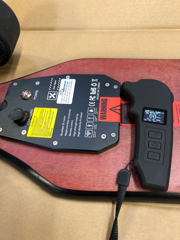 Photo 4 of Teamgee H5 38" Electric Skateboard with Remote, 760W Dual Motors, 22 MPH Top Speed, 13.7Lbs Long Board Hidden Battery the Thinnest Electric Longboard-----------------item has stains on griptape due to usage 