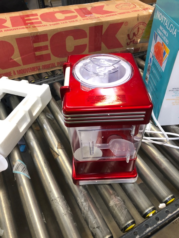 Photo 2 of Nostalgia RSM602 Countertop Snow Cone Maker Makes 20 Icy Treats, Includes 2 Reusable Plastic Cups & Ice Scoop, Retro Red
