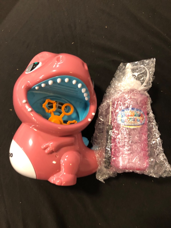 Photo 1 of Dinosaur Bubble Machine for Kids Outdoor Automatic Bubble Maker for Toddlers with Music and Light Eyes Age 3+ (Pink)