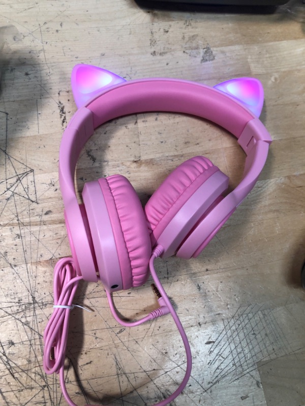 Photo 2 of Cat Ear Led Light Up Kids Headphones with Microphone, iClever HS20 Wired Headphones -Shareport- 94dB Volume Limited, Foldable Over-Ear Headphones for Kids/School/iPad/Tablet/Travel (Medium, Pink)