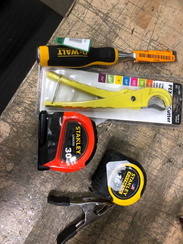 Photo 1 of *** HARDWARE BUNDLE***
5 ITEMS
2 TAPE MEASURES
1 CHISEL
1 Spring Clamp