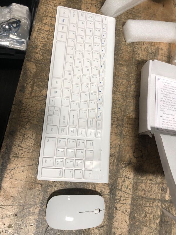 Photo 2 of *** MISSING KEYBOARD RECIEVER****
Wireless Keyboard and Mouse Ultra Slim Combo, TopMate 2.4G Silent Compact USB Mouse and Scissor Switch Keyboard Set with Cover, 2 AA and 2 AAA Batteries, for PC/Laptop/Windows/Mac - White