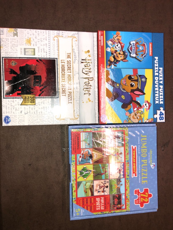 Photo 1 of 3 PACK BUNDLE OF PUZZLES 
Paw patrol/Harry Potter/ and Sports Puzzles