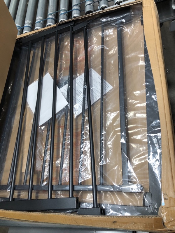 Photo 1 of dark grey metal baby gate