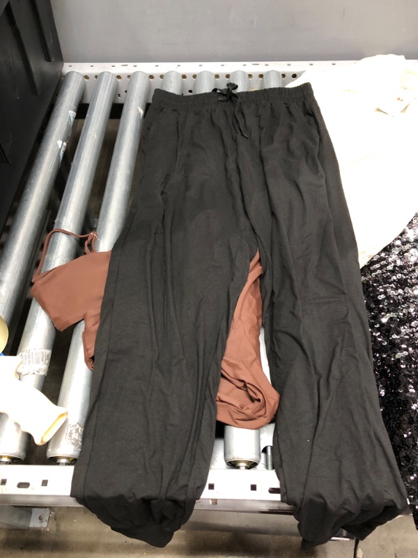 Photo 4 of **BUNDLE OF 4**
--Black sparkly blouse Size M
---Beige short sleeve Size S
---Brown bathing suit Size S
--Black jogger pants Size L