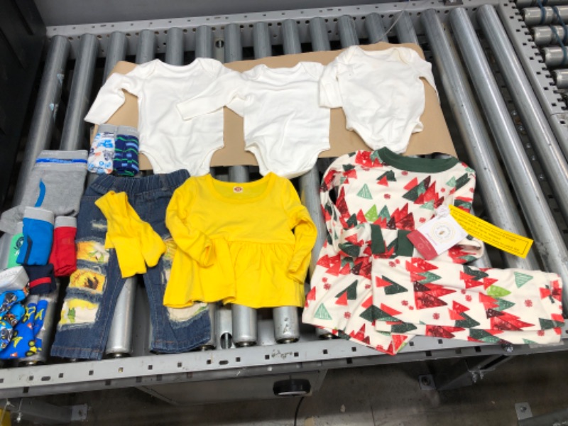 Photo 1 of **BUNDLE OF BABY AND TODDLER CLOTHES**
--Moon & back onesies size 0-3 months white long sleeve
--Burt's bees kids pajamas size 5T
--Girls 2 piece set Size 3-6 months
--Boys boxers Size 2T-3T