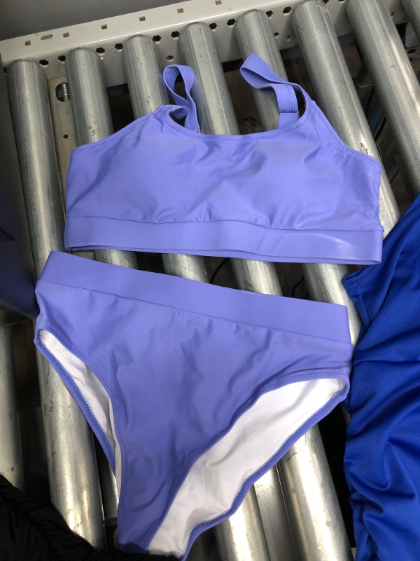 Photo 2 of *BUNDLE OF 3*
Blue dress Size M
Purple bathing suit Size M
Black dress Size S/M