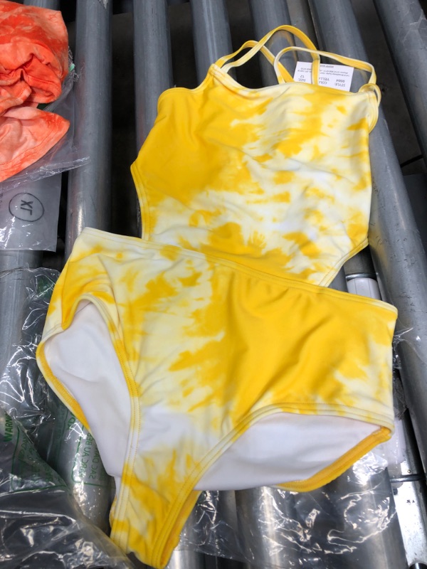 Photo 2 of *BUNDLE*
White kids long sleeve shirt size 4T
Yellow girls swimsuit size 12
Black tshirt XL