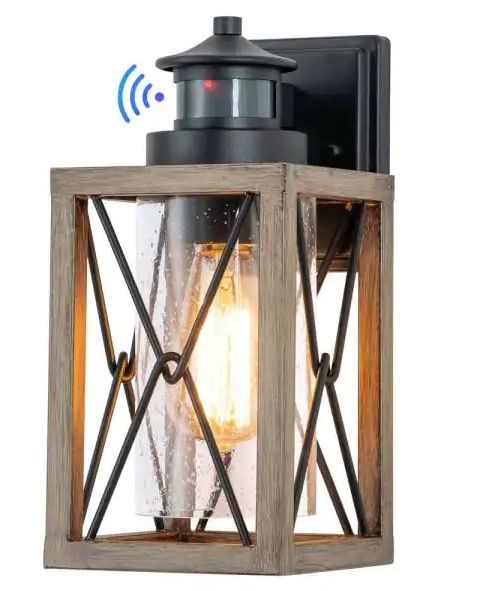 Photo 1 of 1-Light Black and Faux Wood Motion Sensing Dusk to Dawn Outdoor Wall Lantern Sconce with Clear Seeded Glass