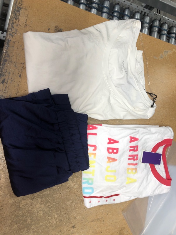 Photo 1 of BUNDLE OF RANDOM WOMENS CLOTHING
WHITE SHIRT 4X, GRAPHIC SHIRT XS, BLUE SATIN SHORTS S