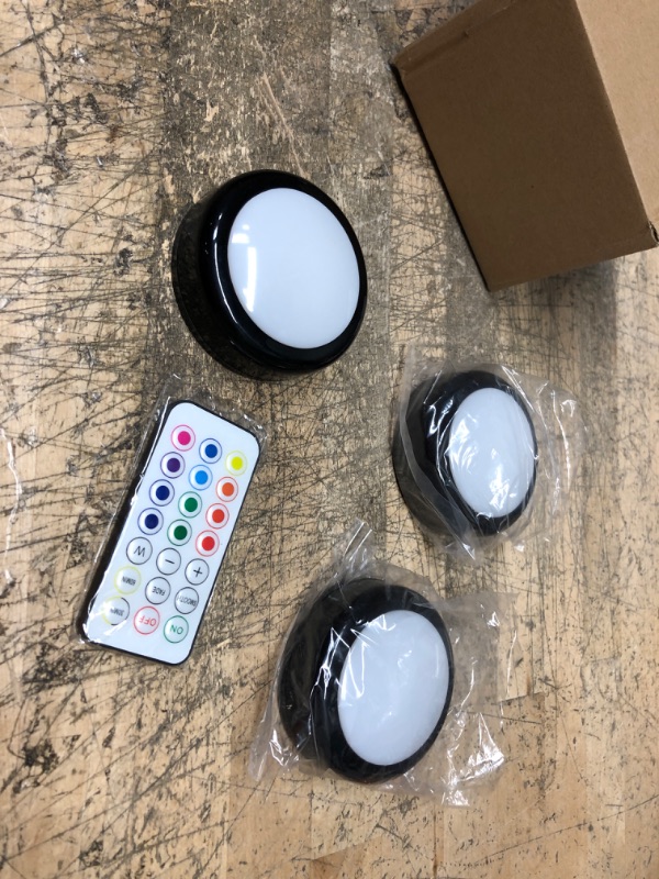 Photo 2 of Puck Lights with Remote, ILYXY 3 Pack LED Under Cabinet Lighting Dimmable Push Lights Battery Operated Wireless Under Counter Lights for Kitchen, Multicolor Transformation Stick On Lights, Shiny Black
