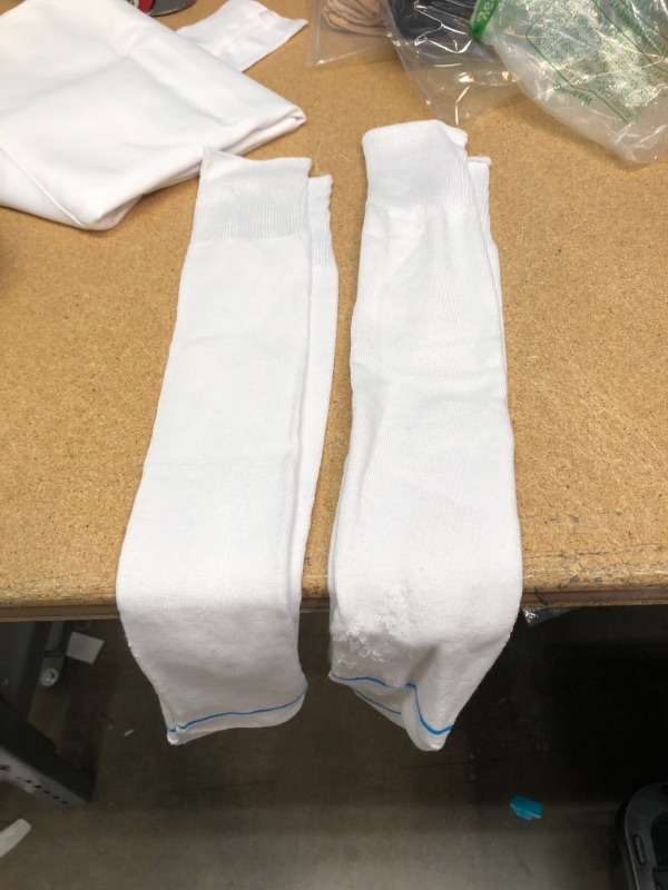 Photo 1 of BUNDLE OF CLOTHES  AND HOME ITEMS PACK OF 4
2 PAIR OF SOCKS **NO SIZE**
1 DRESS **SIZE 2XL**
1 SWIMSUIT FOR WOMEN **UNKNOWN SIZE**
1 LARGE WHITE TABLE CLOTH