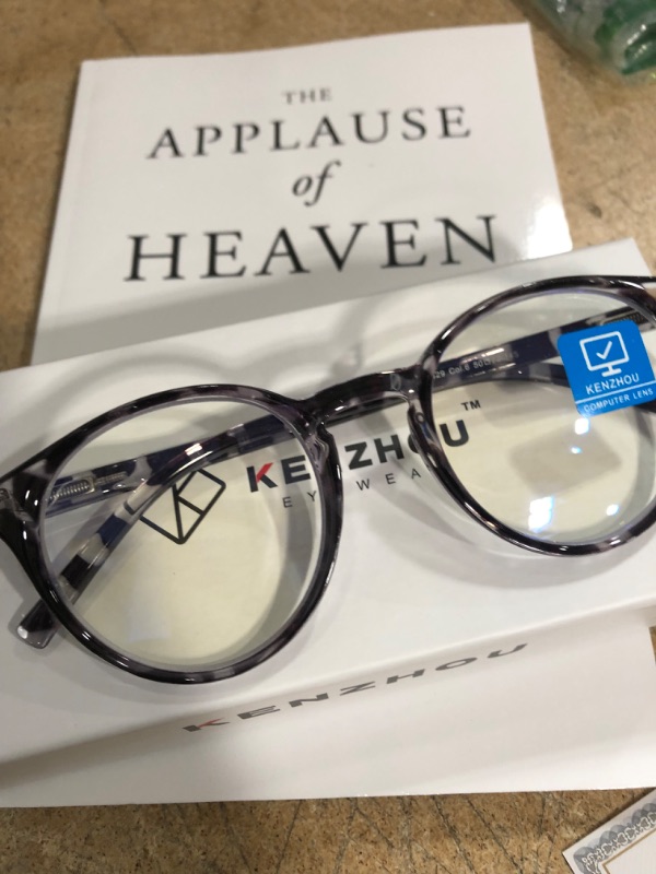 Photo 1 of 1 blue light blocking glasses/ the applause of heaven book