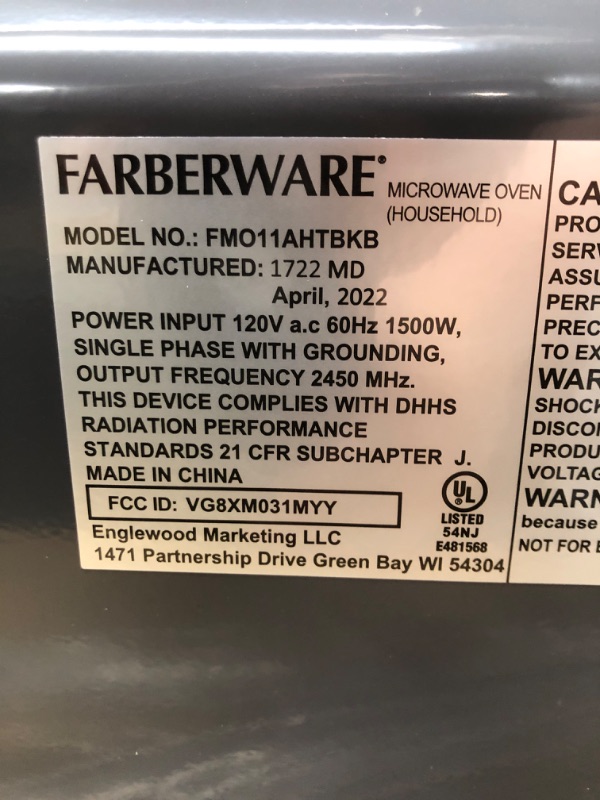 Photo 3 of *** TESTED*** MINOR DENT**** Farberware Countertop Microwave 1.1 Cu. Ft. 1000-Watt Compact Microwave Oven with LED lighting, Child lock, and Easy Clean Interior, Stainless Steel Interior & Exterior