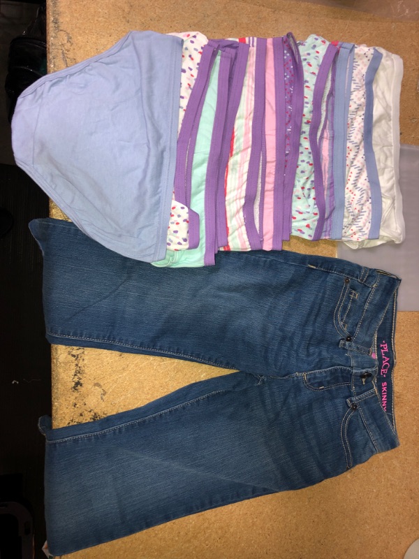 Photo 1 of BUNDLE OF GIRLS CLOTHING... 2
SIZE 6-7 PLACE SKINNY JEANS, 13 PACK FRUIT OF THE LOOMS PANTIES SIZE 10