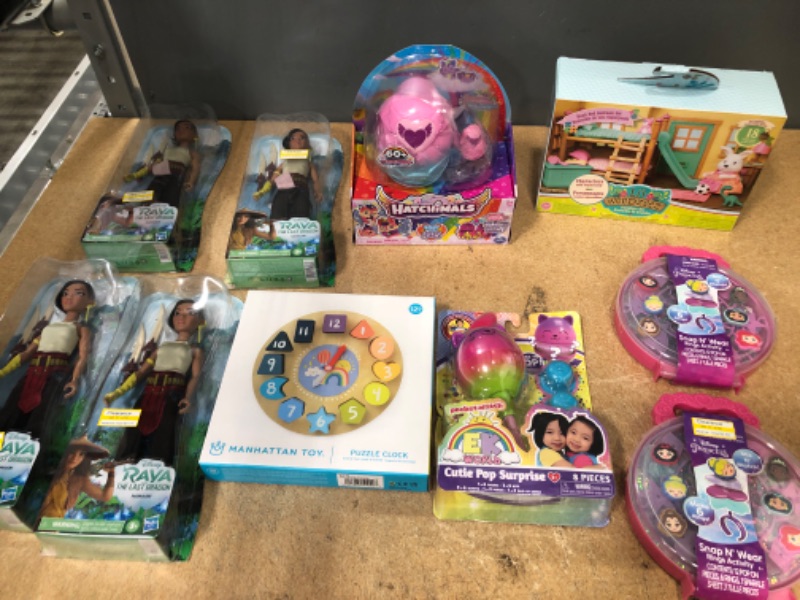 Photo 1 of BUNDLE OF (X2) SNAP AND WEAR DISNEY PRINSESS, LIL' WOODZEES 18PCS SET, EK WORLD CUTIE POPO SURPRISE, 12M CLOCK PUZZLE, HATCHIMALS, (X4) RAYA FIGURINES