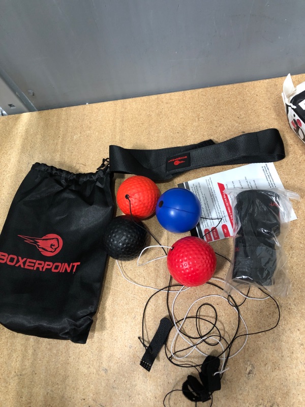 Photo 2 of Boxing Reflex Ball for Adults and Kids - React Reflex Balls on String with Headband