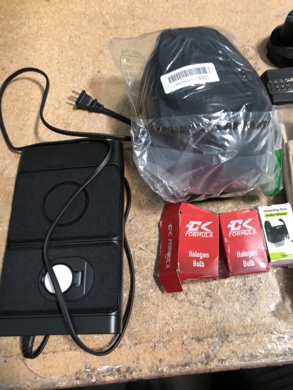 Photo 1 of BUNDLE OF 7 ITEMS CHARGING PAD, HOLDER FOR AIRPODS APPLE WATCH, APPLE WATCH PROTECTOR BAND, TRAVEL PILLOW, HALOGEN BULBS, ROLLING STAMP, LAUNDRY BAGS.