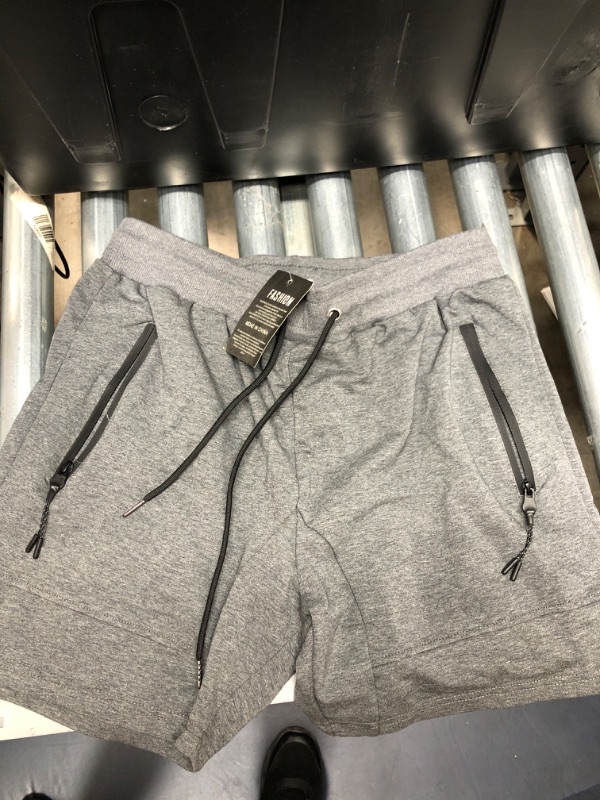 Photo 1 of bundle of XL gray sweat shorts and
6 pack XXXL hanes tang tops
(7 items total)