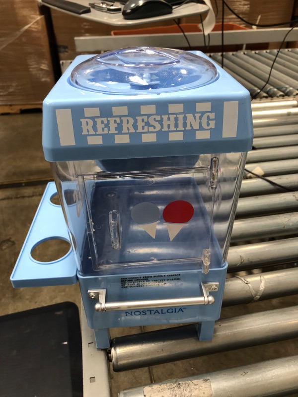 Photo 1 of Nostalgia Vintage Countertop Snow Cone Maker Makes 20 Icy Treats, Includes 2 Reusable Plastic Cups & Ice Scoop – Blue
**missing scoop
