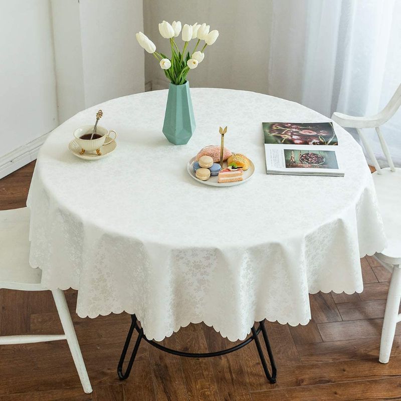 Photo 1 of **DIFFERENT COLOR FROM PHOTO** Smiry Waterproof Vinyl Tablecloth, Round Heavy Duty Table Cloth, Wipeable Table Cover for Kitchen and Dining Room (LIGHT PEACH CREAM COLOR, 60" Round)
