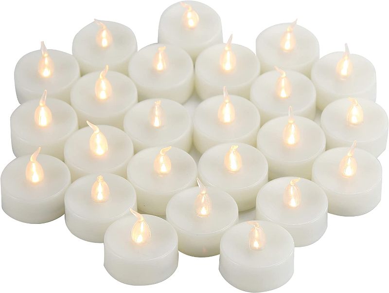 Photo 1 of Flameless LED Tea Lights Flickering White Battery Operated, Electric Fake Tealight Candles Long Lasting for Halloween Christmas Wedding Birthday Party Decorations and Home Decor Batteries Incl 24 Pack
