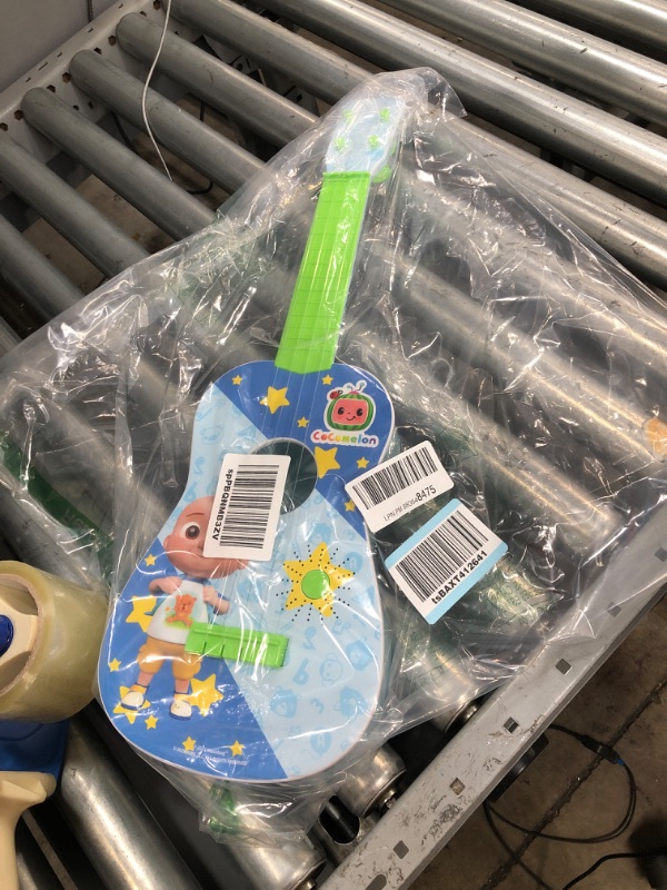 Photo 2 of CoComelon Musical Guitar by First Act, 23.5” Kids Guitar - Plays Clips of The ‘Finger Family’ Song - Musical Instruments for Kids, Toddlers, and Preschoolers
