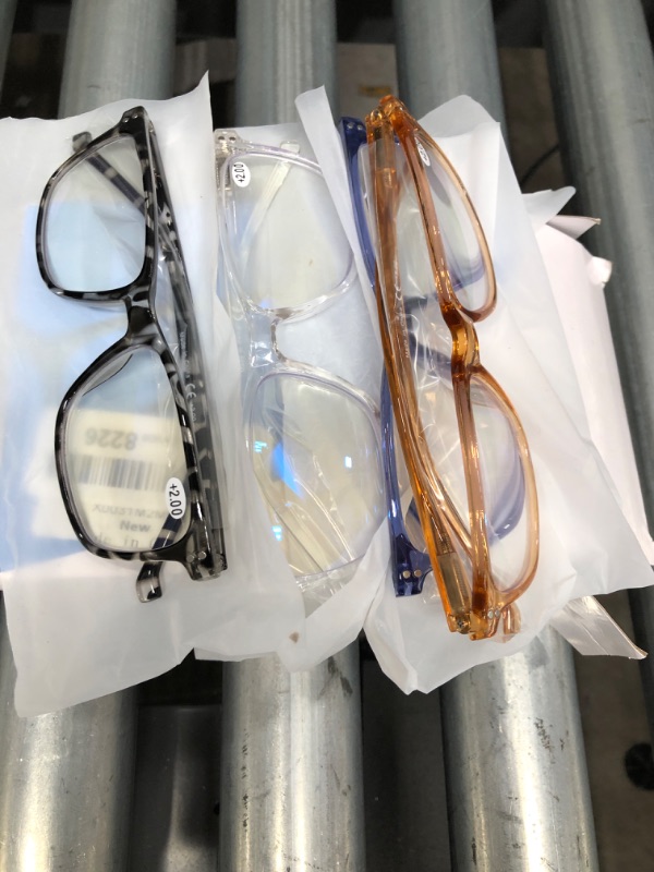 Photo 1 of **BUNDLE OF 4**
--Reading glassess.
--Small umbrella
--2 small balls
--Anti blue light protector