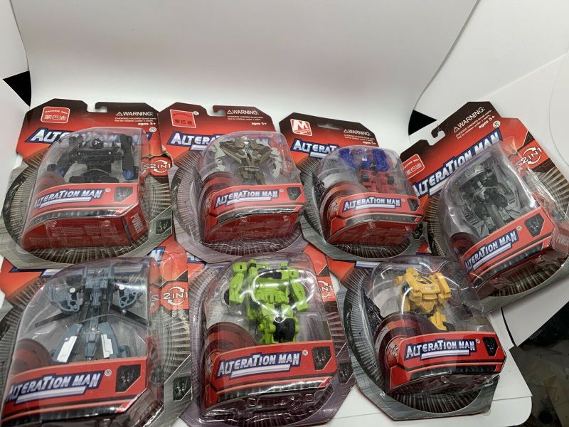 Photo 1 of Lot of 7 AlteraTion Man Transformer Figurines SEALED