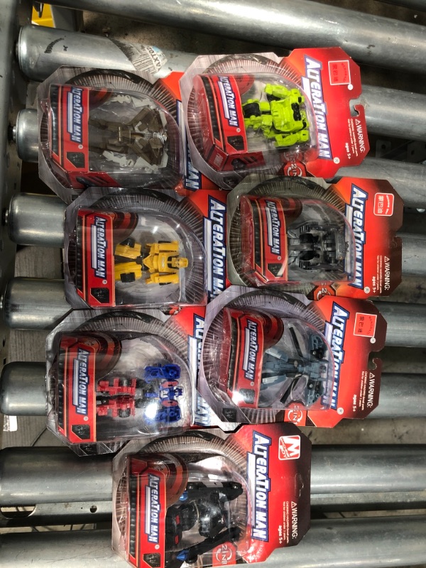 Photo 2 of Lot of 7 AlteraTion Man Transformer Figurines SEALED