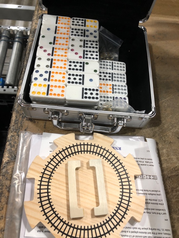 Photo 2 of Homwom Mexican Train Dominoes with Numbers Double 12 Colored Numerical Number Dominoes Mexican Train Game Set 91 Tiles Dominoes with 9 Trains, Scoreboard, Octagon Shape Hub and Aluminum Case
