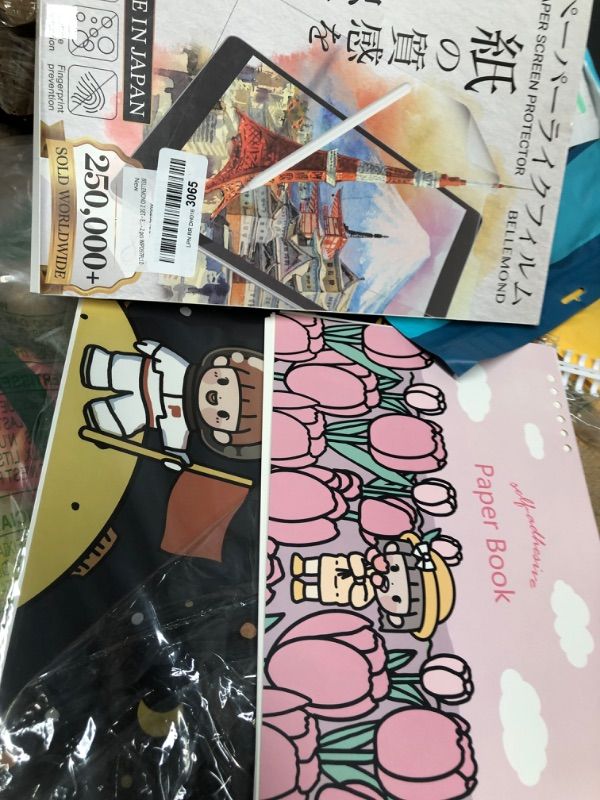 Photo 1 of bundle of adhesive paper books/ paper screen protector