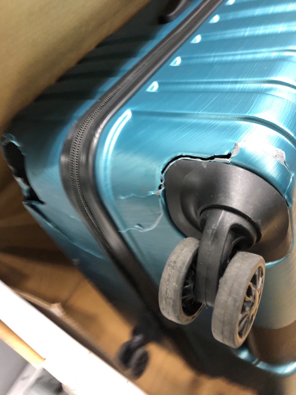 Photo 3 of ***broken wheels***
U.S. Traveler Boren Polycarbonate Hardside Rugged Travel Suitcase Luggage with 8 Spinner Wheels, Aluminum Handle, Teal, Checked-Large 30-Inch Checked-Large 30-Inch Teal