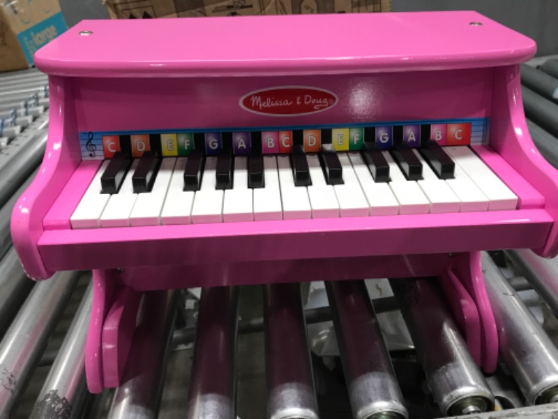 Photo 2 of Melissa & Doug Learn-to-Play Pink Piano With 25 Keys and Color-Coded Songbook