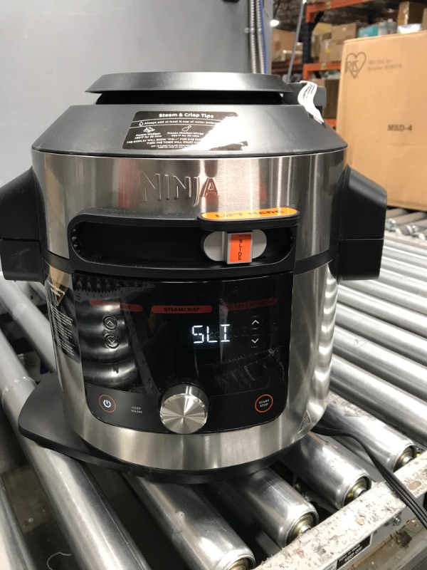 Photo 2 of (tested)Ninja OL601 Foodi XL 8 Qt. Pressure Cooker Steam Fryer with SmartLid, 14-in-1 that Air Fries, Bakes & More, with 3-Layer Capacity, 5 Qt. Crisp Basket & 45 Recipes, Silver/Black 8-Quart 3-Layer Meals Silver/Black