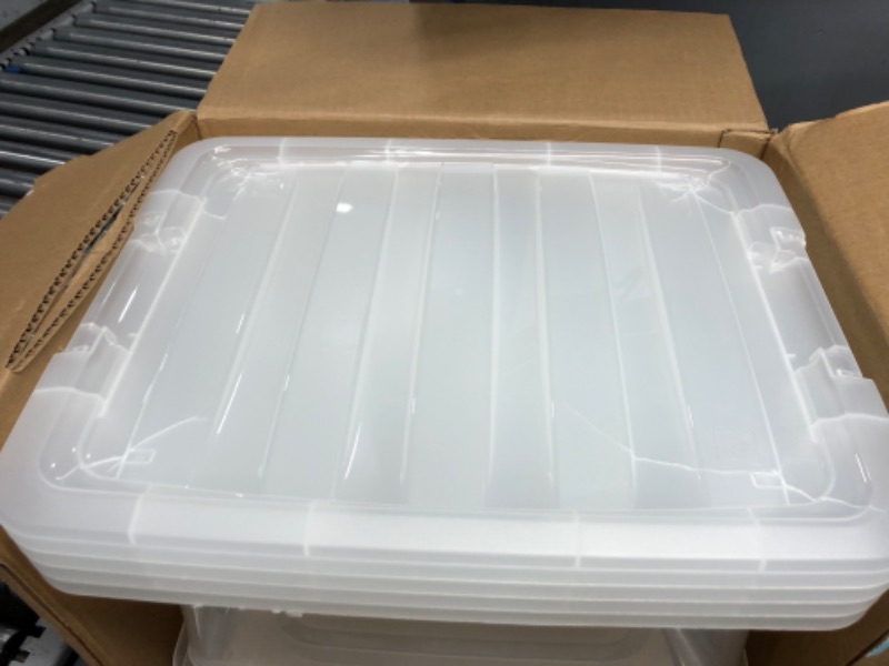 Photo 3 of **corner of lids***
IRIS USA 32 Qt. Plastic Storage Tote, 4 Pack, Clear, Bin Organizing Container with Durable Lid and Secure Latching Buckles, Clear 32 Qt. - 4 Pack Clear