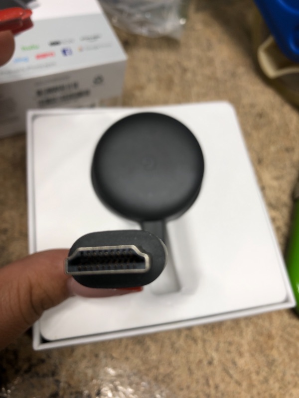 Photo 2 of Google Chromecast - Streaming Device with HDMI Cable - Stream Shows, Music, Photos, and Sports from Your Phone to Your TV
