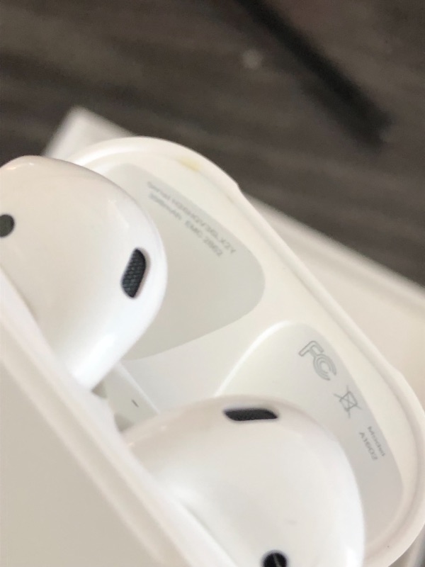 Photo 2 of Apple AirPods True Wireless Bluetooth Headphones (2nd Generation) with Charging Case

