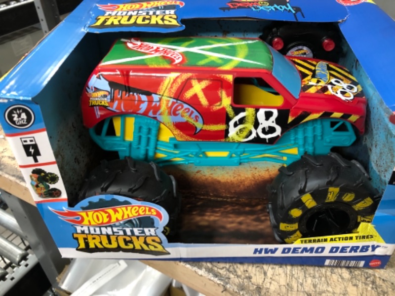 Photo 2 of ?Hot Wheels RC Monster Trucks 1:15 Scale HW Demo Derby, 1 Remote-Control Toy Truck with Terrain Action Tires, Toy for Kids 4 Years Old & Older
