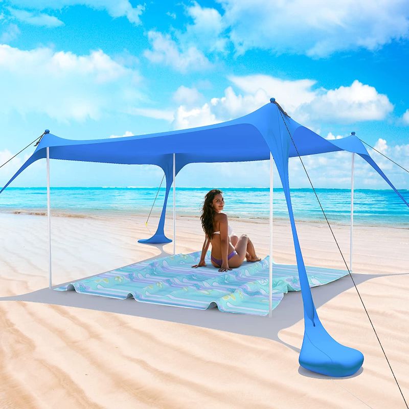 Photo 1 of  Beach Tent Pop Up Shade Canopy Sun Shelter UPF50+ with 4 Stability Poles/Carry Bag/Ground Pegs/Sand Shovel/Windproof Ropes Portable Outdoor Family Sunshade for Beach Camping(Royal Blue10×10FT)
