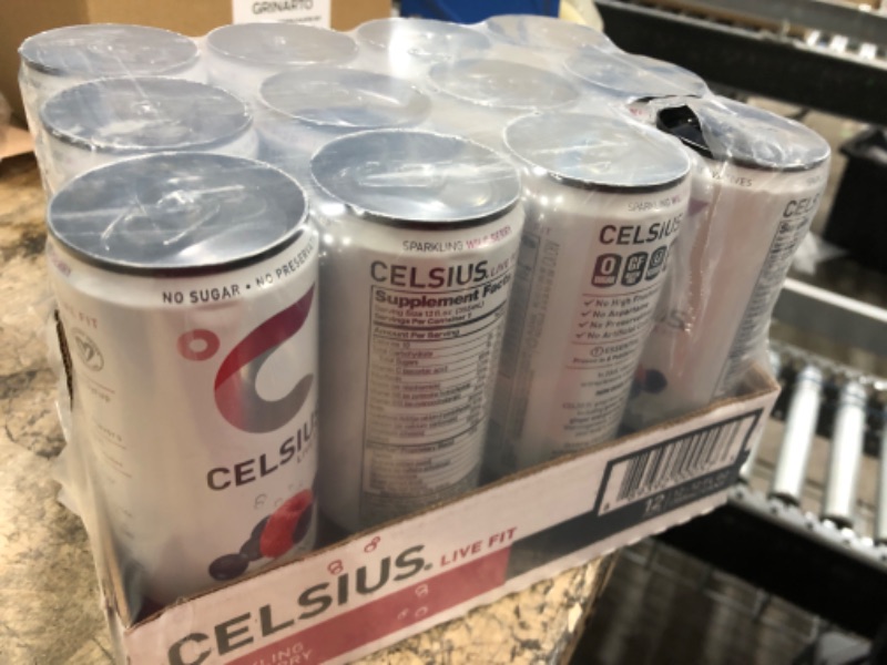 Photo 2 of **EXP DATE 01/2023** CELSIUS Sparkling Wild Berry, Functional Essential Energy Drink 12 Fl Oz (Pack of 12) Sparkling Wild Berry 12 Fl Oz (Pack of 12)