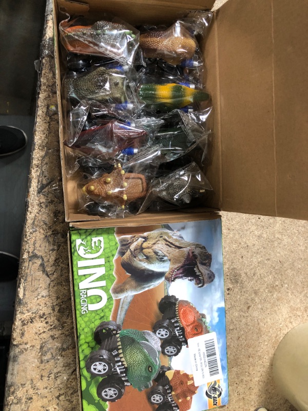 Photo 1 of 2 pack of 8 dino racing toys