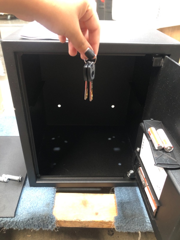 Photo 1 of Amazon Basics Steel Home Security Safe with Programmable Keypad - Secure Documents, Jewelry, Valuables - 1.52 Cubic Feet, 13.8 x 13 x 16.5 Inches, Black
