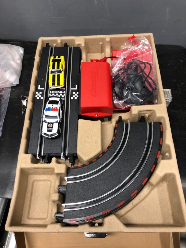 Photo 2 of Carrera GO!!! Battery Operated 1:43 Scale Slot Car Racing Toy Track Set with Jump Ramp for Kids Ages 5 Years and Up, Highway Chase