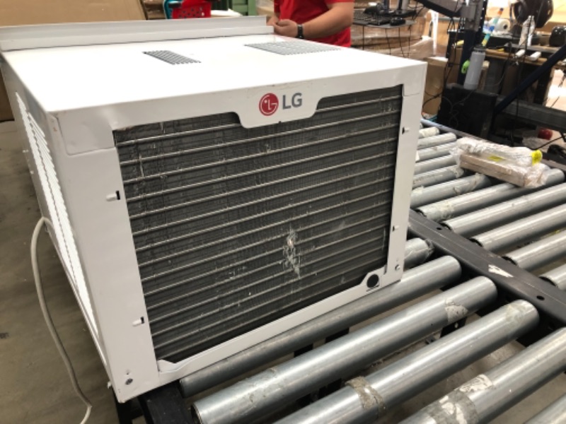 Photo 7 of **needs assembly-minor damage-please view photos**
LG 7,500 BTU Window Air Conditioner with Supplemental Heat, Cools 320 Sq.Ft. (16' x 20' Room Size), Electronic Controls with Remote, 2 Cooling, Heating & Fan Speeds, Slide In-Out Chassis, 115V
