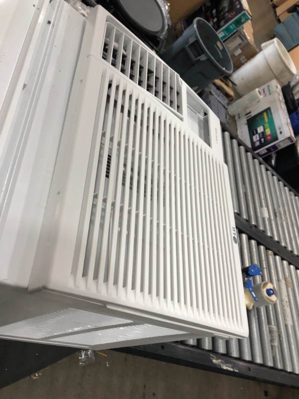 Photo 6 of **needs assembly-minor damage-please view photos**
LG 7,500 BTU Window Air Conditioner with Supplemental Heat, Cools 320 Sq.Ft. (16' x 20' Room Size), Electronic Controls with Remote, 2 Cooling, Heating & Fan Speeds, Slide In-Out Chassis, 115V
